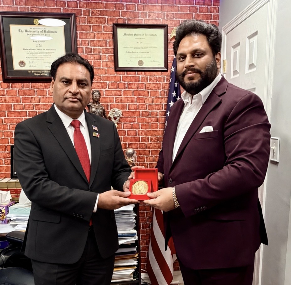 Mr. Ali Raza receiving an AURA recognition medal